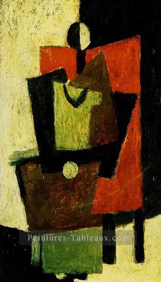 Femme assise dans un fauteuil rouge 1918 Cubisme Peintures à l'huile